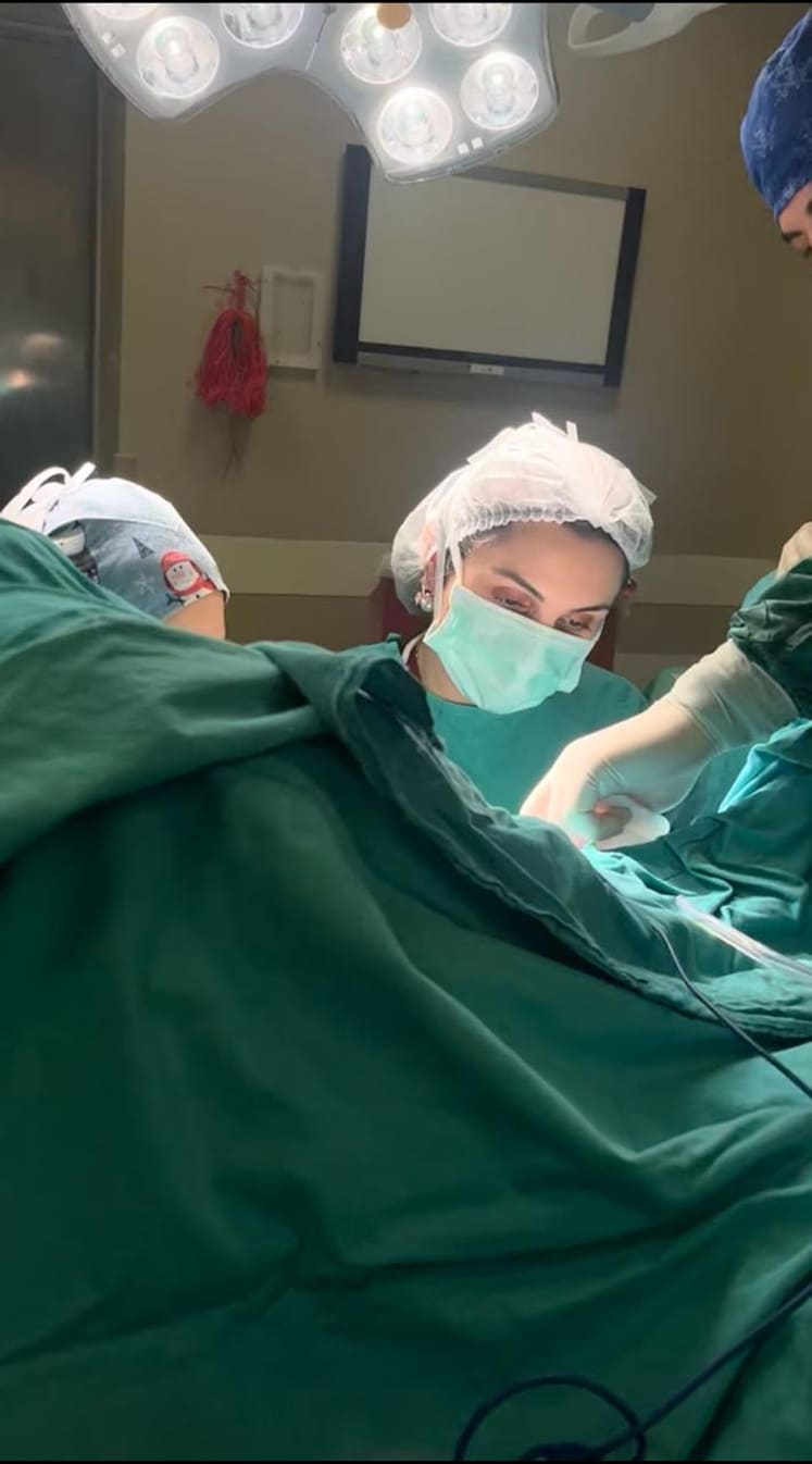 Expert gynecologists performing surgery